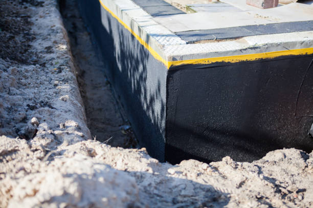 Professional Waterproofing technician working in Clarksville, MI